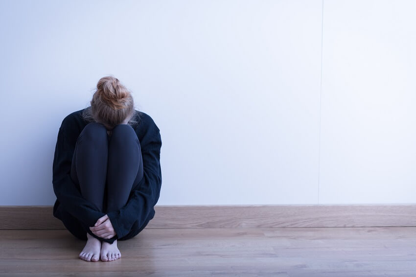 woman-sitting-with-depression.jpg