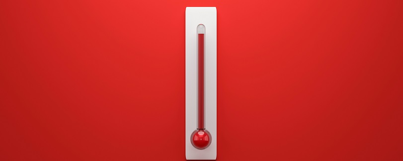 image of thermometer with a high level against a red background